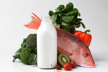 Bottle of milk, fish, fruits and vegetables.