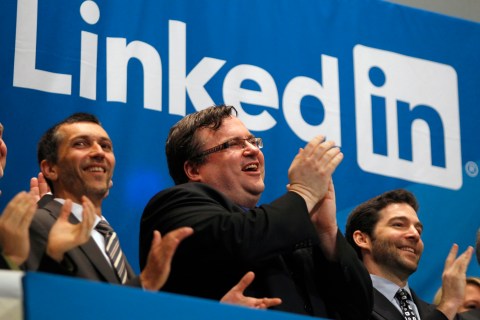 Linkedin founder and CEO applaud from bell balcony of New York Stock Exchange after opening bell during IPO