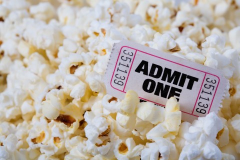 A single Admit One ticket and popcorn