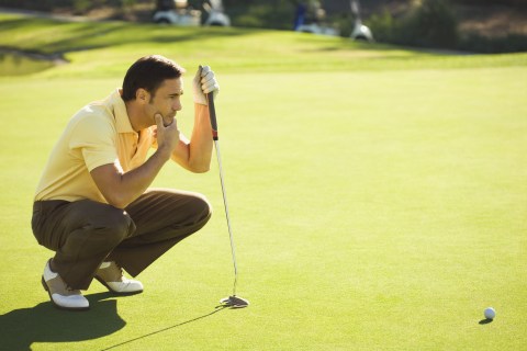 Golfer thinking about his shot