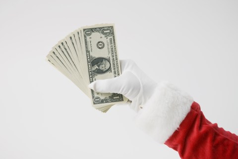 Santa holding cash