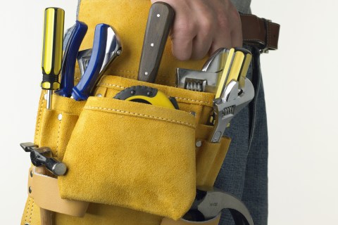 Construction worker wearing tool belt