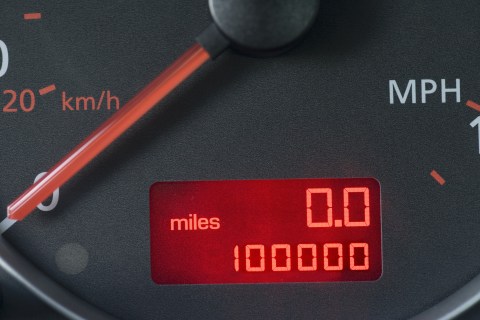 Close-up of odometer reading 100,000