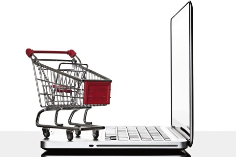 Shopping cart and laptop computer still life