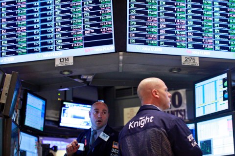File photo of traders at work at the Knight Capital kiosk on the floor of the New York Stock Exchange