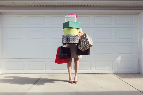 Woman with shopping bags and boxes