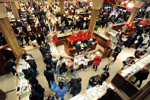 People crowd the aisles inside Macy's department store November 25, 2011 in New York after the midnight opening to begin the "Black Friday" shopping weekend.  