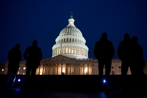 image: People gather outside the U.S. Capitol in Washington, Jan. 1, 2013.
