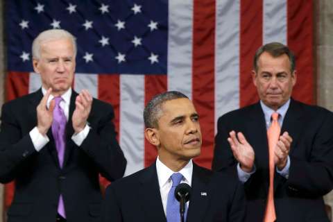 U.S. House Speaker John Boehner and Vice President Joe Biden stand to applaud as President Barack Obama delivers his State of the Union speech on Capitol Hill in Washington, Feb. 12, 2013. 