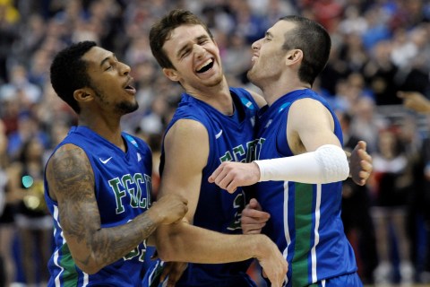 Florida Gulf Coast's Dajuan Graf, from left, Eddie Murray and Brett Comer celebrate after winning a third-round game against San Diego State in the NCAA college basketball tournament, on March 24, 2013, in Philadelphia. Fla.