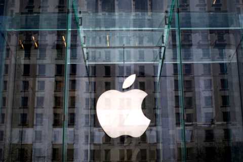 File photo of the Apple logo inside the glass entrance to the Apple Store on 5th Avenue in New York City