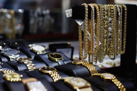 Watches and gold jewellery in a display case inside the Gold Standard jewellery store, specializing in purchasing raw gold and silver in New York City, on April 15, 2013.