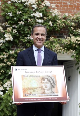 Governor of the Bank of England, Mark Carney holds the concept design for the new Bank of England ten pound banknote, featuring author Jane Austen, at the Jane Austen House Museum in Chawton, England on July 24, 2013.