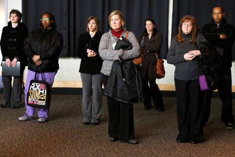 Job seekers listen to a presentation at the Colorado Hospital Association health care career fair in Denver, on April 9, 2013.