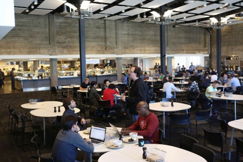 Twitter employees sit in a cafeteria at the company's headquarters in San Francisco