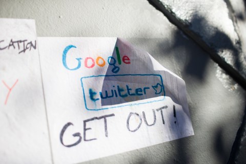 Signs in opposition of technology companies are seen in San Francisco
