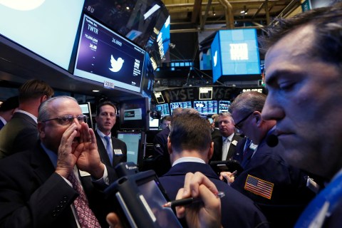 Traders get to work during Twitter's IPO on the floor of the New York Stock Exchange in New York Nov. 7, 2013.